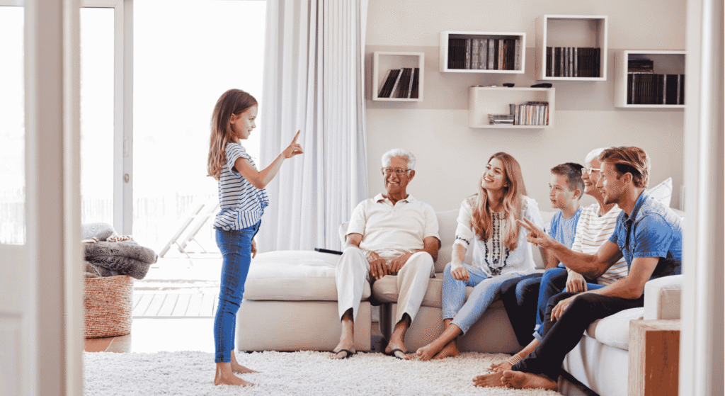 Grandparents, parents and a young child gathered in a bright living room, the kind of relaxed family meeting that keeps an estate plan from becoming a surprise