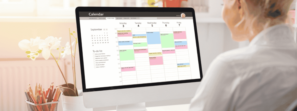 A woman reviewing a calendar on her computer, a reminder to schedule a regular estate plan review
