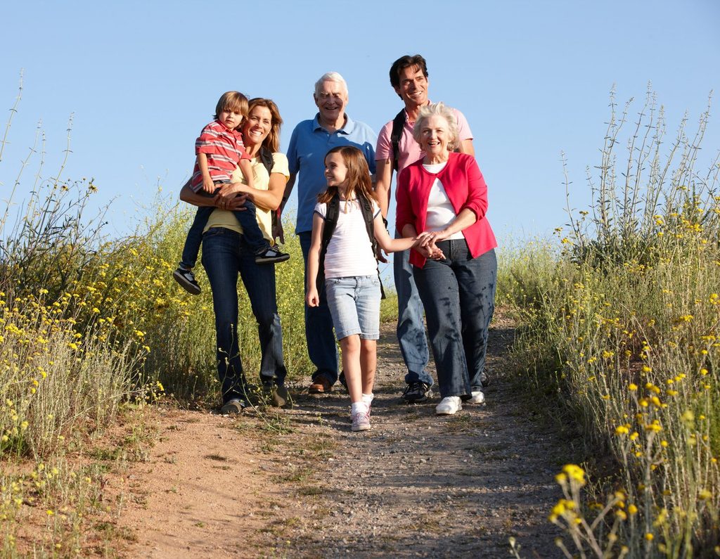 Three generations of a family hiking a trail together, a reminder of what a long-term plan is for