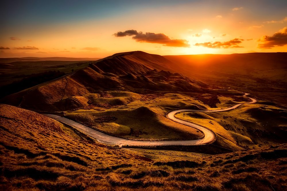 Winding road through hills at sunset, illustrating a shift in market leadership in August 2026